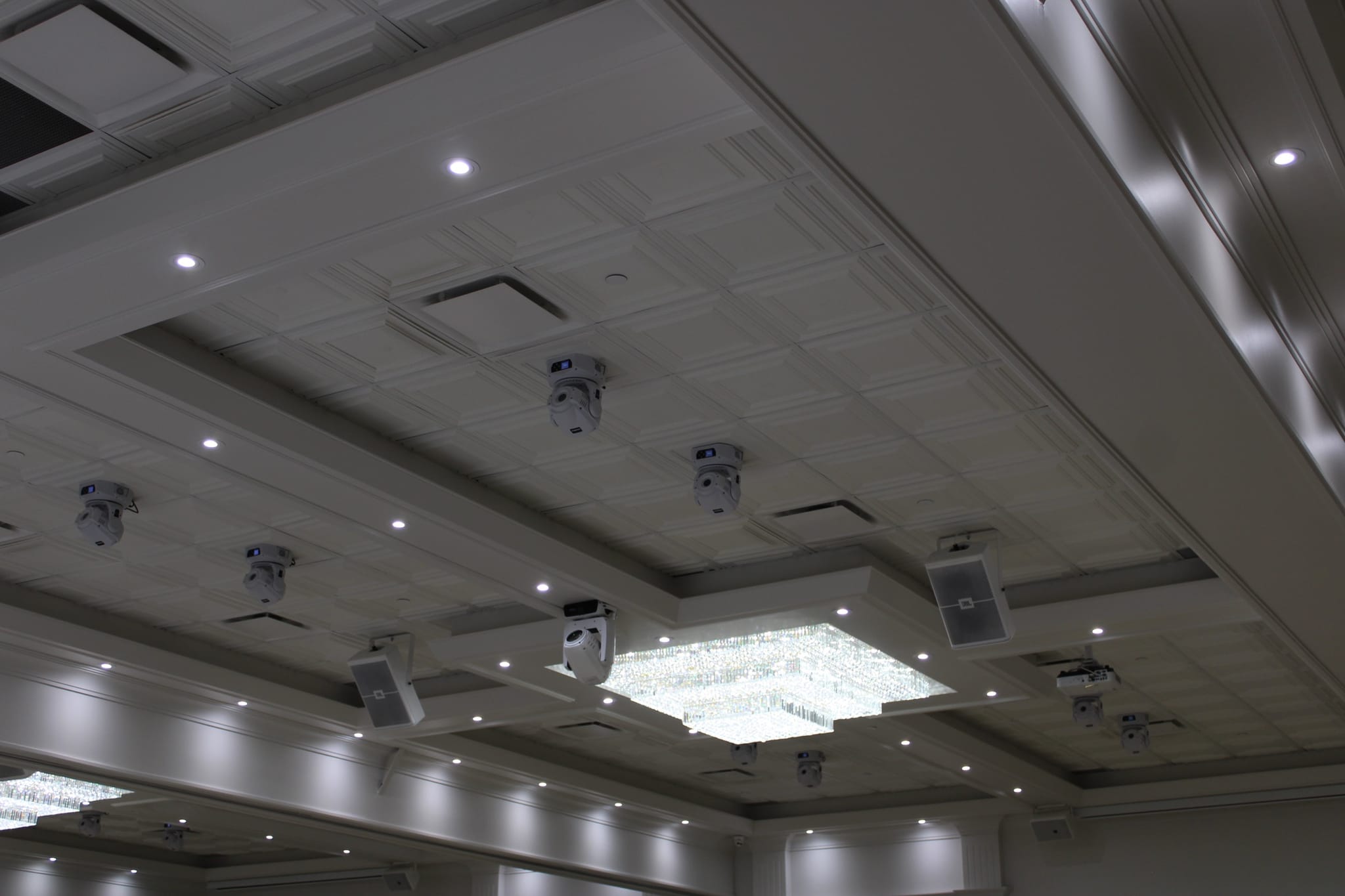 Overhead DJ lights and chandelier